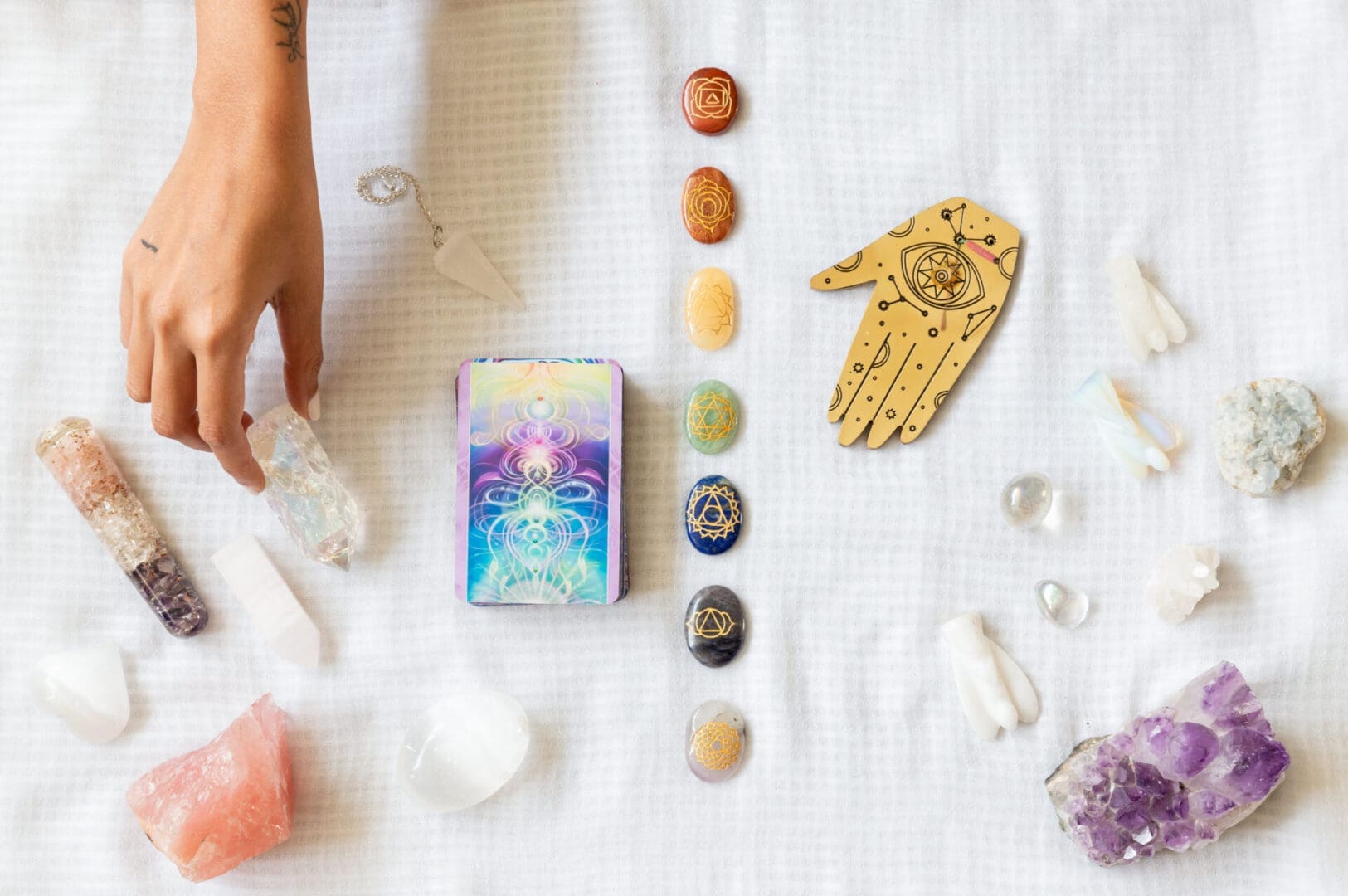 crystals-and-tarot-cards-on-white-fabric-2026-03-17-04-59-30-utc